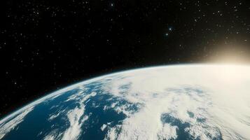 Planet earth rotating in space with sun rising from horizon photo