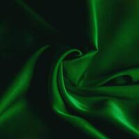 photo of emerald silk fabric template of fabric roll of fabric
