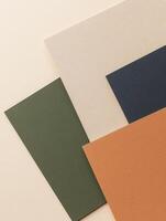 Arrangement of textured paper sheets in complementary earthy tones, showcasing color harmony photo