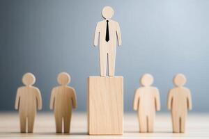 Leadership Hierarchy, Wooden figure stands above peers, symbolizing success and authority photo