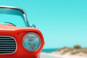 Vibrant red car detail against a bright blue sky evokes summer vibes and open road adventures photo
