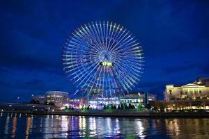 A night illuminated ferris wheel in Yokohama wide shot photo