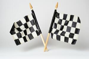 Two Checkered Flags Fluttering Together Isolated on White Background photo