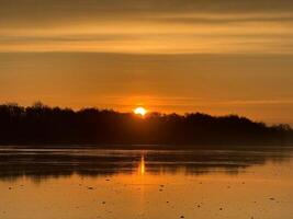 Dawn in the morning in nature on the river photo