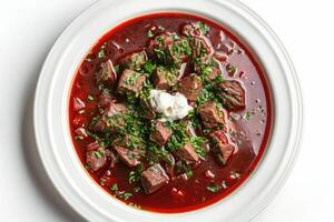 Plate with soup ukrainian borsch on white background photo