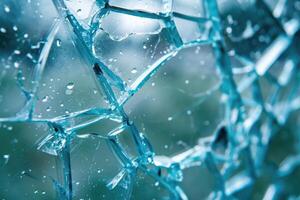 Close-up of shattered blue glass photo
