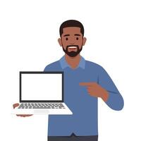Young man character holding or showing the blank screen of a laptop computer and pointing hand finger. vector