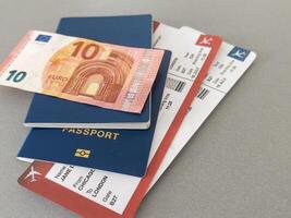 Euro, Passport and air tickets on a black background. mockup empty blank, copy space. photo