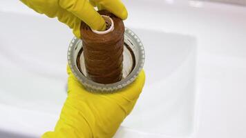 Plumber working replaceable dirty used water filter for filtration of reverse osmosis water video