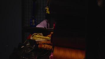 The dance of colorful rope wraps Rolls on the shelf with shadow video