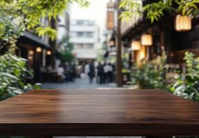 A wooden table in a vibrant outdoor setting with blurred background. photo