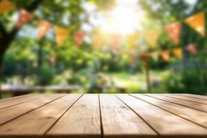 Wooden table top with blurred background in summer garden photo
