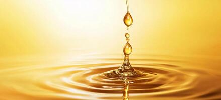 A close-up of a golden liquid drop creating ripples in water. photo