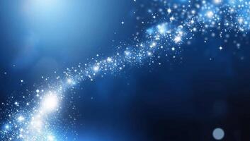 A cosmic scene featuring sparkling stars against a blue background. photo