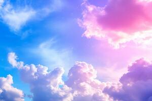 A serene sky filled with soft clouds and a gradient of blue and pink hues. photo