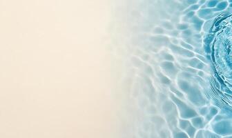 A serene water surface with gentle ripples against a light background. photo