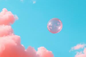 A translucent bubble floating against a bright blue sky with pink clouds. photo