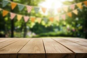 A wooden table in a sunny park setting with festive bunting. photo