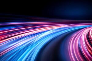A dynamic display of colorful light trails on a dark background. photo