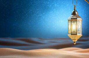 A glowing lantern hangs over a serene desert landscape at night. photo
