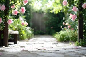A serene garden path adorned with pink roses leading to a lush green area. photo