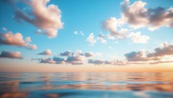 Serene ocean view with soft clouds and a colorful sunset. photo