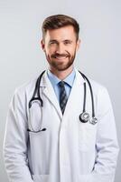 A male doctor in a white coat and tie photo