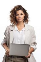 A woman in a white blazer holding a laptop photo
