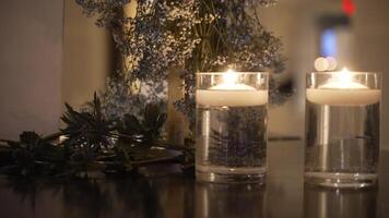 Floating Candles in Glass with Gentle Floral Backdrop video