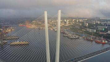 View from a drone vertically down to the Golden Bridge and the city at sunset video