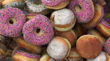 Falling Different donuts on a pink background video