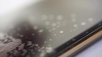 Finger gliding across smartphone screen with fingerprint smudges closeup sequence in high resolution. video