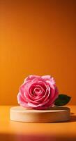 A single pink rose on a wooden stand with podium photo