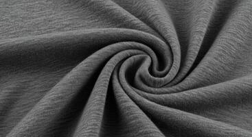 A close up shot of a soft, high quality T shirt fabric showcasing its texture and design. photo