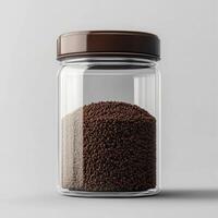Glass container of coffee grounds, on a white background. 1 photo