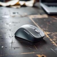 Modern Computer Mouse Placed on a Desk Surface photo