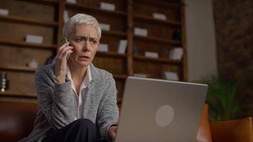 Worried Senior Businesswoman on Phone Call While Working video