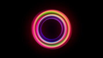 Vibrant concentric circles glow against a dark background, abstract design use video