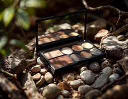 Cosmetic palette with shadows on a background of stones in the forest. Eyeshadow Palette in Nature photo