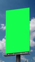 Portrait blank green billboard or large advertising display. Chroma key, time lapse, green screen, template, mock up and copy space concept promotion product sale video