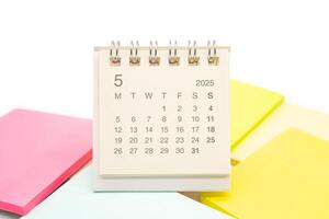 Mini Desk Calendar for MAY 2025 background. Calendar concept with 2025 MAY calendar. Sticky note. isolated on white background. photo