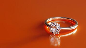 A wedding band, silver ring with diamond on an orange background. 13 photo