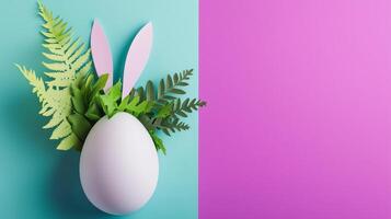 Paper-cut Easter egg with bunny ears design with real green leaves, set on blue and purple background. 12 photo