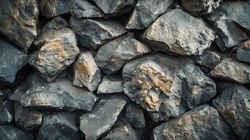 Rough textured stone wall, gray color. Rock texture. Rock background. Construction or abstract concept. Architecture. Building material photo