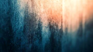 Textured Wall A close-up of an aged concrete wall featuring cool blue and warm orange tones, highlighting depth and texture. photo