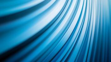 Abstract Blue Curved Lines A dynamic interplay of light and shadow creates depth and movement across a surface of softly converging blue lines. photo