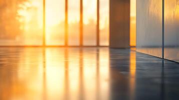Golden sunlight streams into a minimalist space, reflecting off a polished floor, creating a warm, luminous, and inviting ambiance. photo