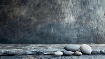 Zen stones Serene composition of smooth pebbles on a rugged stone surface, evoking tranquility and harmony in a spa-like setting. photo