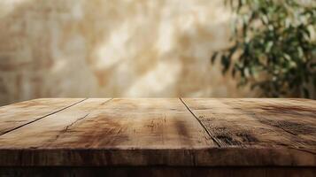 Wooden Table Surface A weathered wooden table stands ready for use, with a textured wall and blurred foliage creating a warm backdrop. photo
