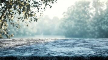 A serene waterscape unfolds behind a stone ledge, framed by foliage. Mist hangs in the air, adding an ethereal quality to the scenic view. photo